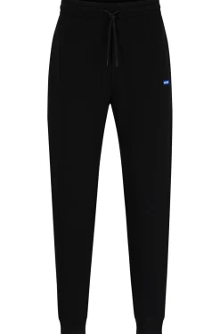 Jogginghose aus Baumwoll-Terry mit blauem Logo-Aufnäher